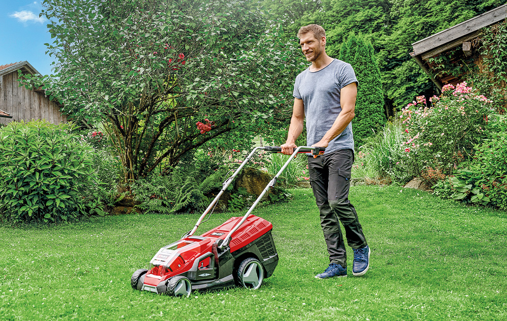 A man mowing the lawn. 