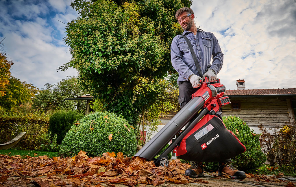 A man using the cordless leaf vacuum. 