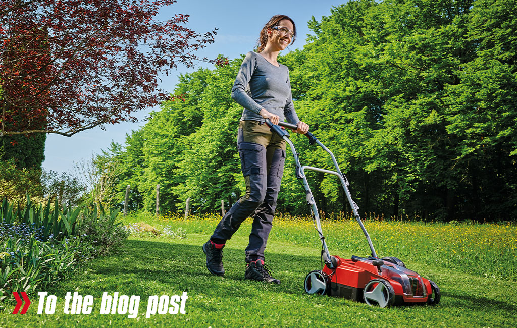 A woman mowing the lawn. 