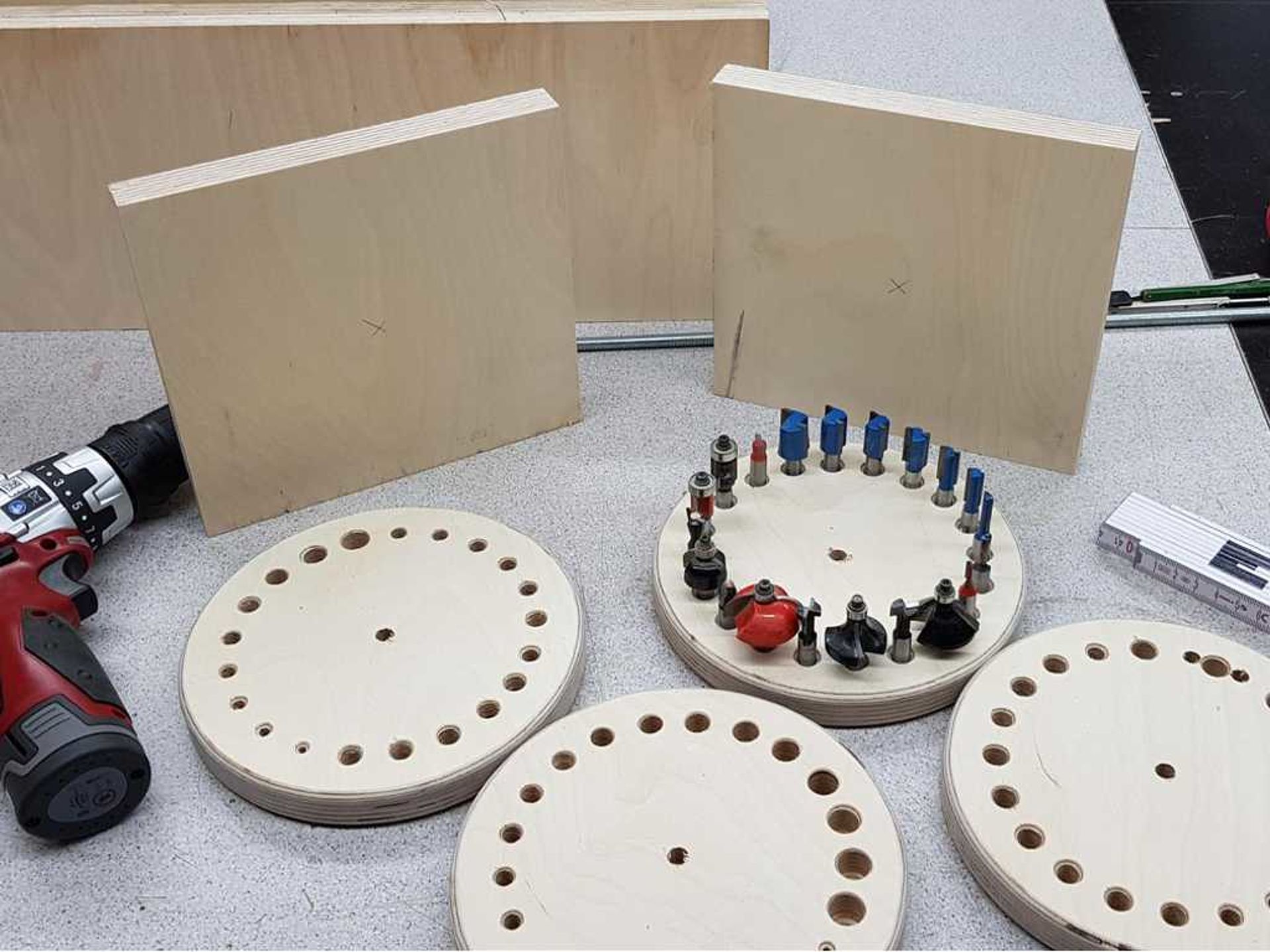 four wooden circles with holes in them for a cutter carousel