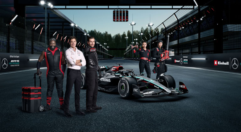 E team members alongside the Formula 1 team