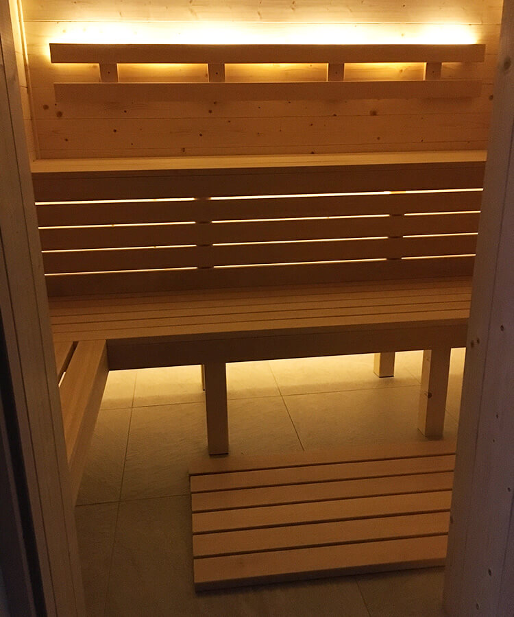 self-built wooden sauna with lighting