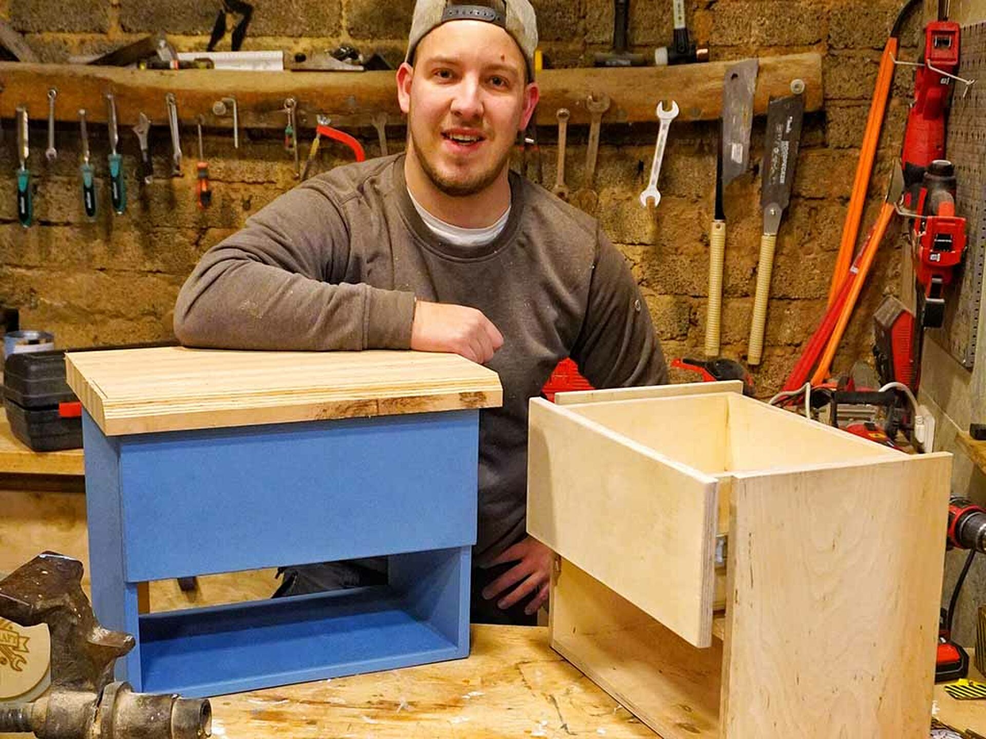 man with two wooden boxes